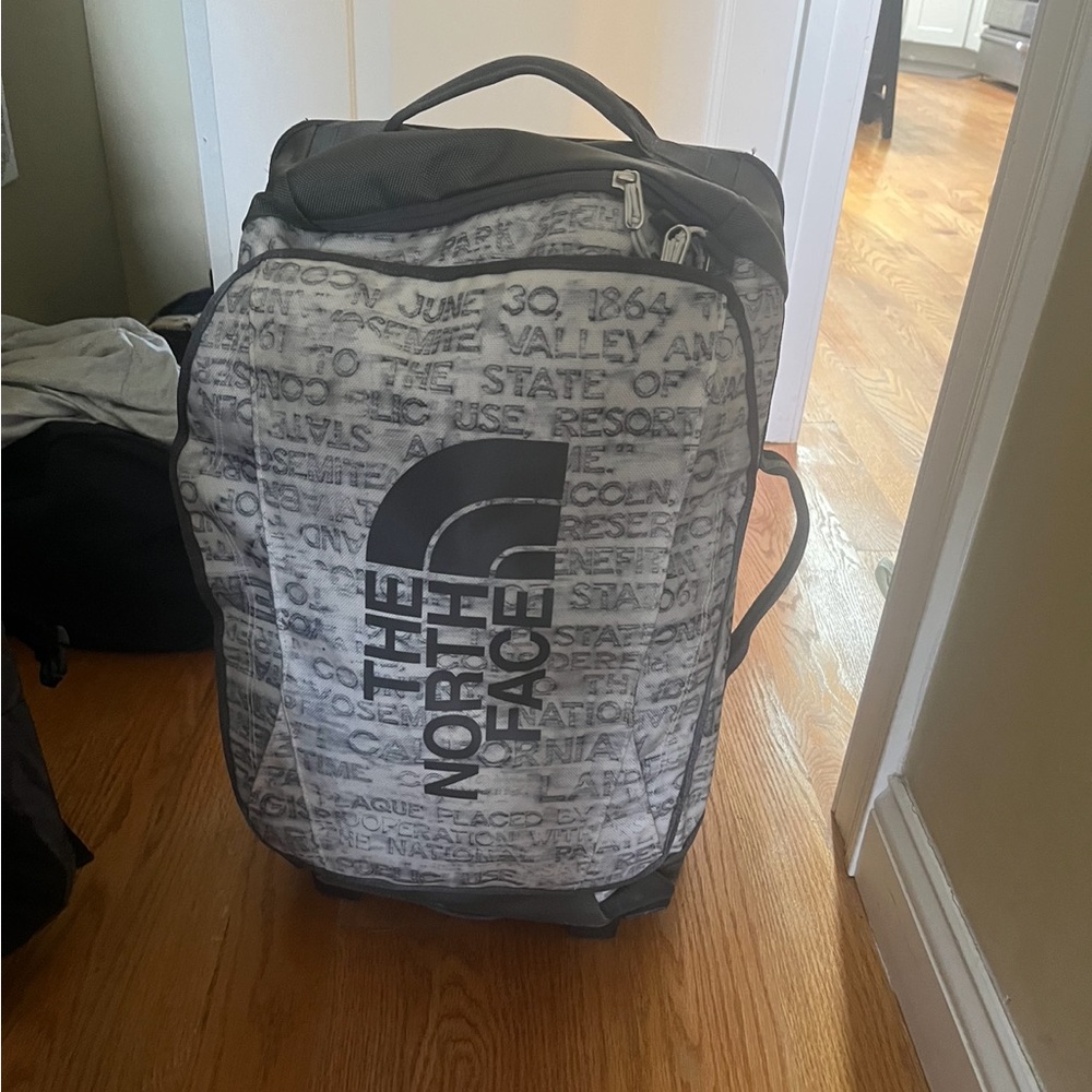 Grey and white north face duffle/carry on